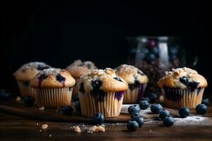 Blueberry muffins with fresh blueberries on a table, close up, dark background. A delicious dessert or breakfast. AI generated. photo