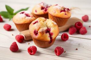 Raspberry muffins with fresh raspberries on a white wooden table, close up. A delicious dessert or breakfast. AI generated. photo