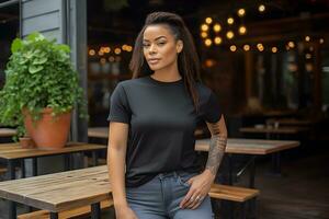 Young african woman wearing bella canvas black t shirt and jeans, at a cozy restaurant on summers day. Design tshirt template, print presentation mockup. Ai generated. photo