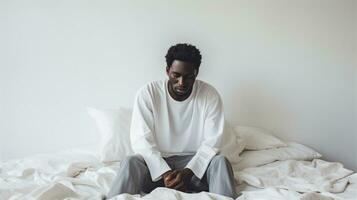 Young african american man sitting on the bed in the morning Generative AI photo