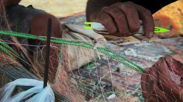 Fisherman Repairs Fishnets Fishing Lines video