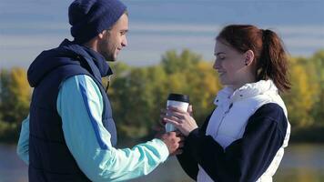 Young athlete with morning coffee for girlfriend video