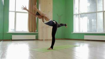 Sport fitness woman doing yoga exercises video