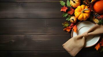 Thanksgiving table setting with pumpkins and autumn leaves on wooden background Generative AI photo