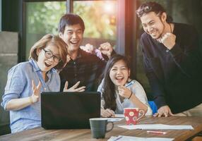 asian freelance teamwork happiness emotion looking to laptop computer in home office photo