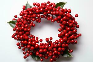 A DIY Christmas wreath with red berries isolated on a white background photo