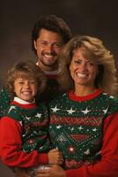 Family in 90s holiday sweaters cheerfully posing by a Christmas tree photo