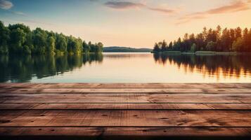 de madera mesa con un antecedentes de un calma lago a amanecer foto
