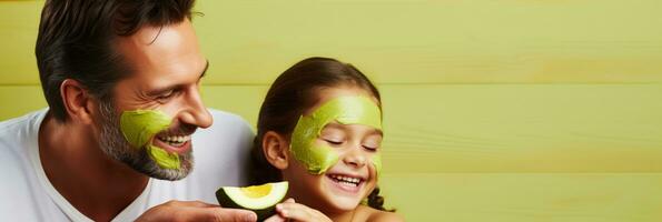 A father and daughter bonding while applying a DIY avocado facial mask relaxing spa background with empty space for text photo