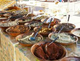 Delicious fresh olives and olive dishes at the street market photo