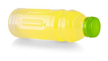 Plastic bottle of orange juice isolated on white photo