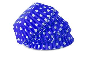 blue polka dot cupcake paper cup isolated over the white background photo