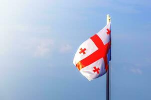 flag of georgia against the blue sky photo