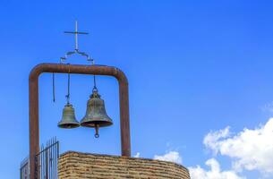 Orthodox bell tower and bell in the old church photo