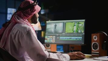 Arabic colorist freelancer editing outsourcing cinematographic project, creating content creation stock footage, working with images and sounds. Teleworking worker processing movie on PC workstation video