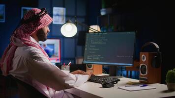 Technician writing script code on computer screen using Java programming languages for outsourced project. Teleworking employee at home fixing intranet database errors, handheld camera shot video