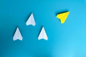 Top view of white and yellow paper airplane. With space for text. photo