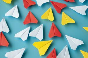 Top view of assorted colorful paper airplanes. Airplane concept photo