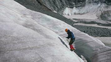 Man Ascends the Rope on the Mountain Slope video