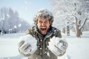 Energetic individual engaged in lively snowball fight amidst snowy scenery photo