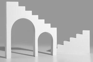 Simple geometrical shapes with arches and steps on gray background photo
