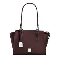 Dark maroon medium sized handbag of genuine leather with two handles isolated on white photo