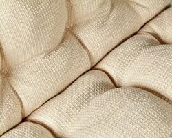 Closeup of soft window cushion of beige linen fabric photo