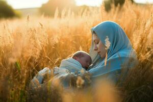 Woman with headscarf with baby asleep in golden plant field. Generate ai photo