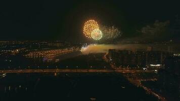 Fireworks in the city. River with bridge. Drone is flying forward. Aerial view. video