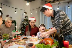 Happy asian family celebrating Christmas and New Year together at home. photo