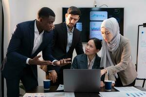 Multiethnic group of business people working together in a modern office photo