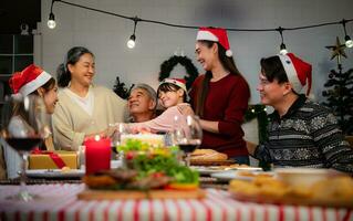 Happy asian family celebrating Christmas and New Year together at home. photo