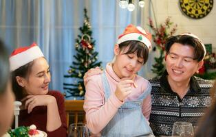 Happy asian family celebrating Christmas and New Year together at home. photo