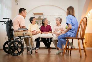 Elderly people talking with nurse in nursing home. Elderly people in nursing home concept. photo