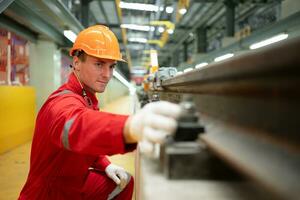 After the electric train is parked in the electric train repair shop, an electric train technician with tools inspect the railway and electric trains in accordance with the inspection round photo