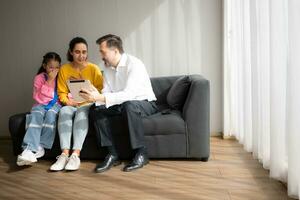 Psychotherapist working with child patient and mother in office, Concept of psychotherapy photo