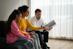 Psychotherapist working with child patient and mother in office, Concept of psychotherapy photo