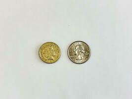 UK one pound and us quarter dollar coins photo