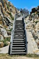 stairs leading to the top of a rocky mountain photo