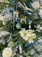 Silver and white Christmas tree decorations. Closeup photo