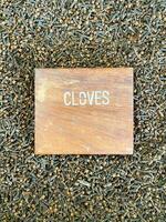 Cloves top view with a nameplate in the middle photo