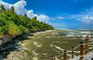 Melia Zanzibar beach on low tide. Panorama. Blue sky. View from pier photo