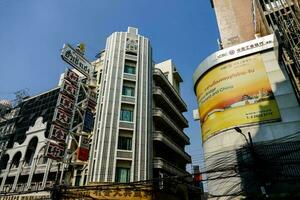 a tall building with a large advertisement on it photo