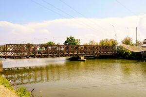 a bridge over a river with a train on it photo