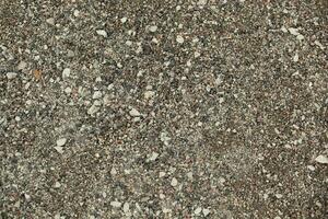 Small seas with gray-colored stones. Asphalt. Texture. Background. For text Tallinn photo