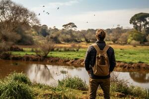 Birdwatcher observing in tranquil wildlife sanctuary background with empty space for text photo