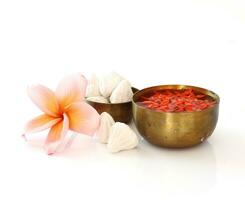 Group of bowl of water,flower and clay  on white photo