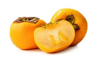 Orange ripe persimmons with half in stack isolated on white background with clipping path photo