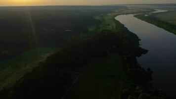 Oka River, Meadow and Forest at Sunrise in Summer. Landscape of Russia. Rural Countryside. Aerial View. Drone Flies Forward, Tilt Up video