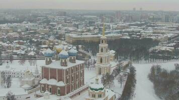 Ryazan Kremlin and Cityscape in Winter on Cloudy Day. Bell Tower and Cathedral. Russia. Aerial View. Orbiting video